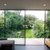 Slim sliding glass door was installed with high quality aluminium framing which was concelaed into the building to maximise the glazing. The glass door was expanded the space throught to the garden space! Visit the link to look at the other amazing projects!